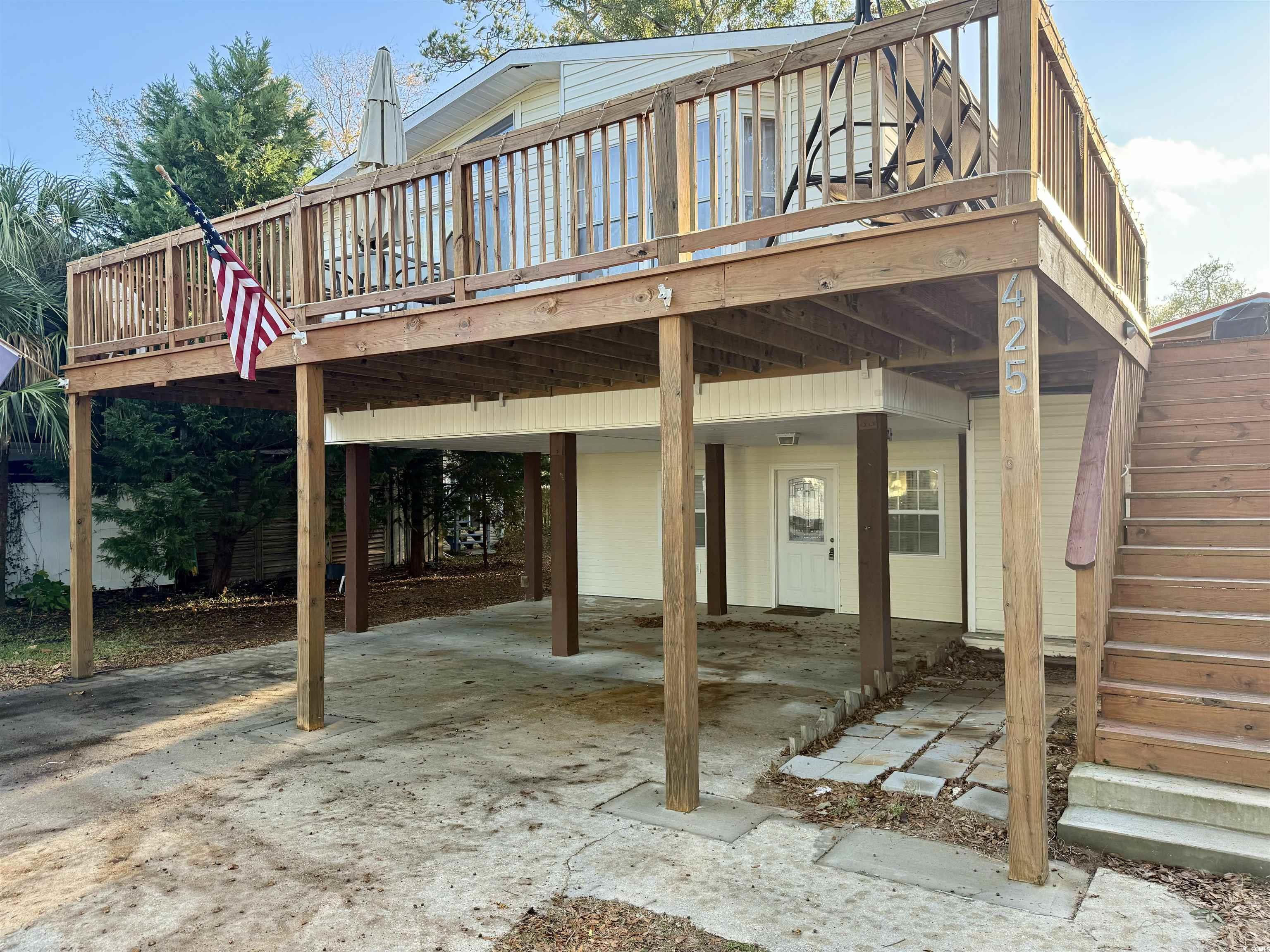 View of patio featuring a wooden deck