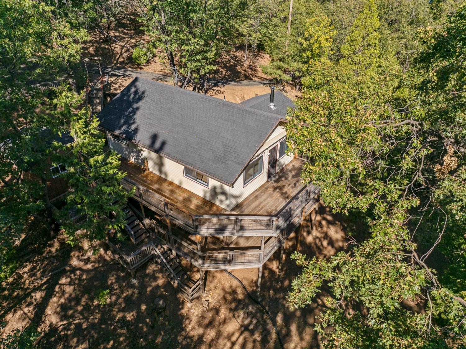 a view of a house with a tree