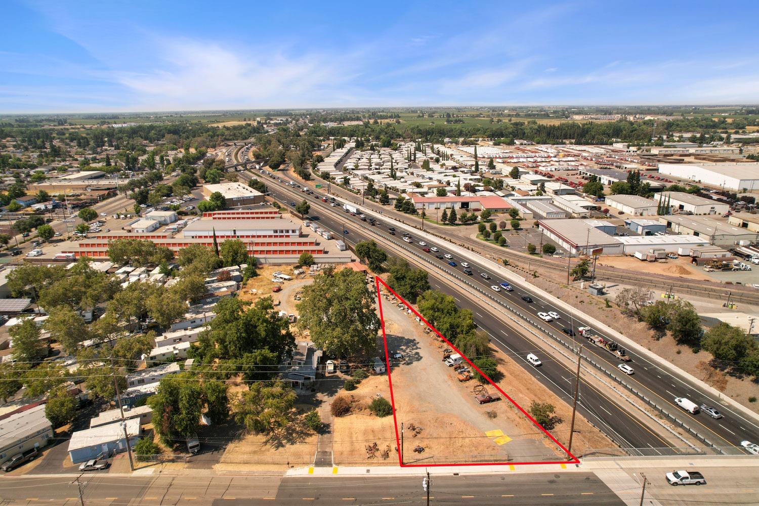 an aerial view of residential building with parking