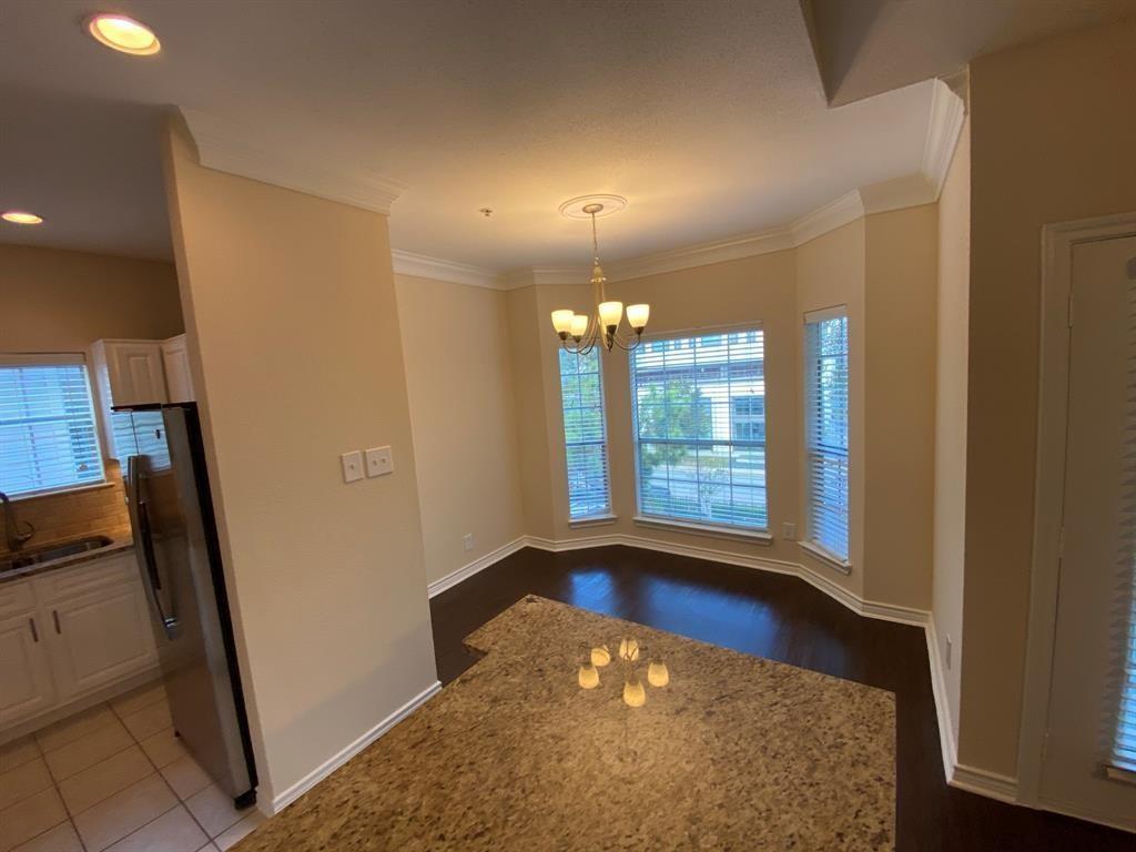 a view of a room with window and wooden floor