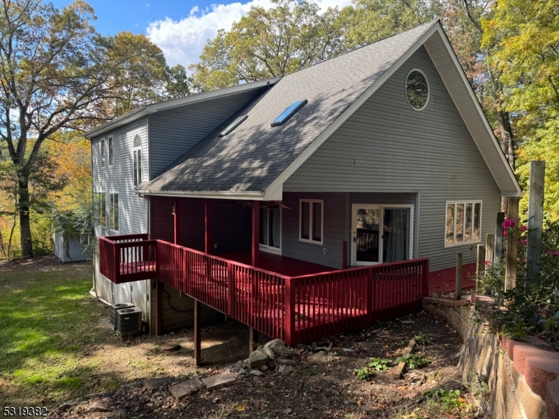 a front view of house with a garden