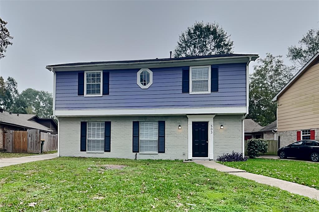 front view of a house with a yard