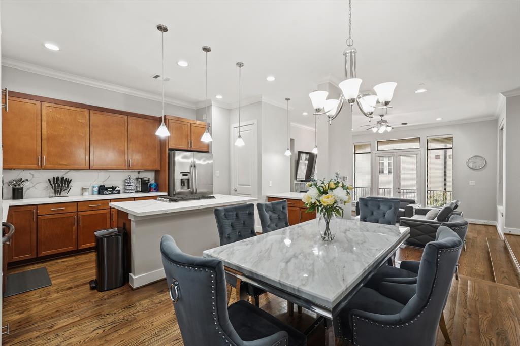 a kitchen with a table and chairs in it