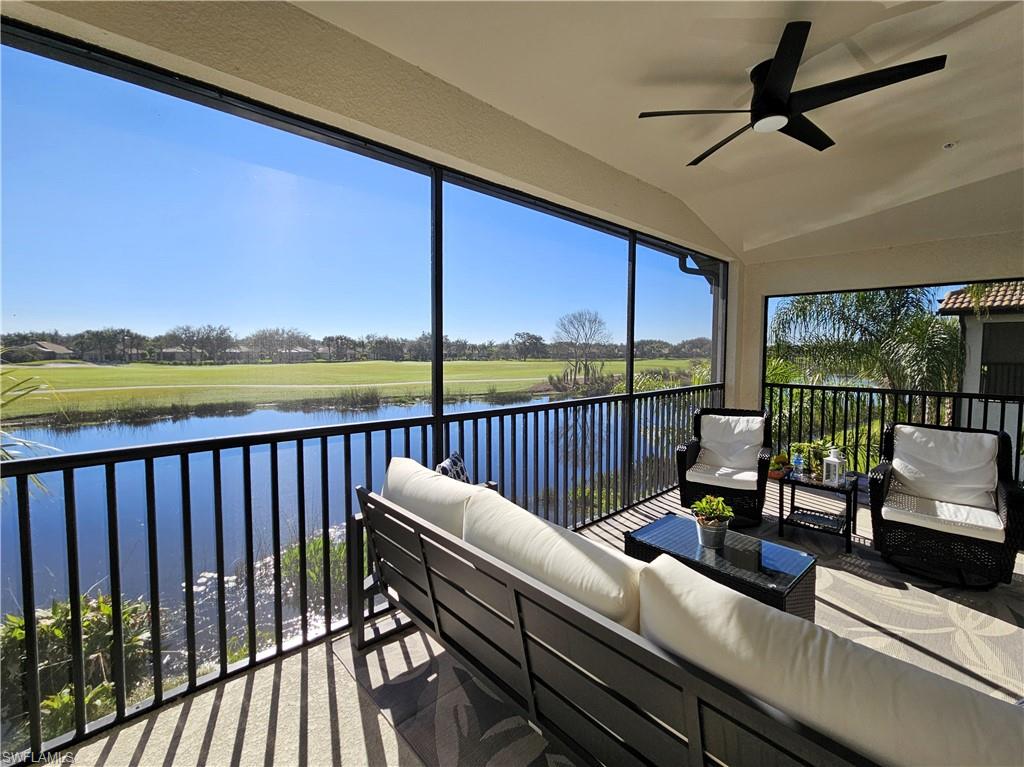 a view of a balcony with lake view and a potted plant