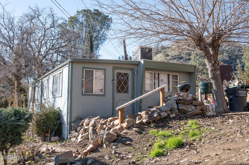 a front view of a house with yard porch and seating