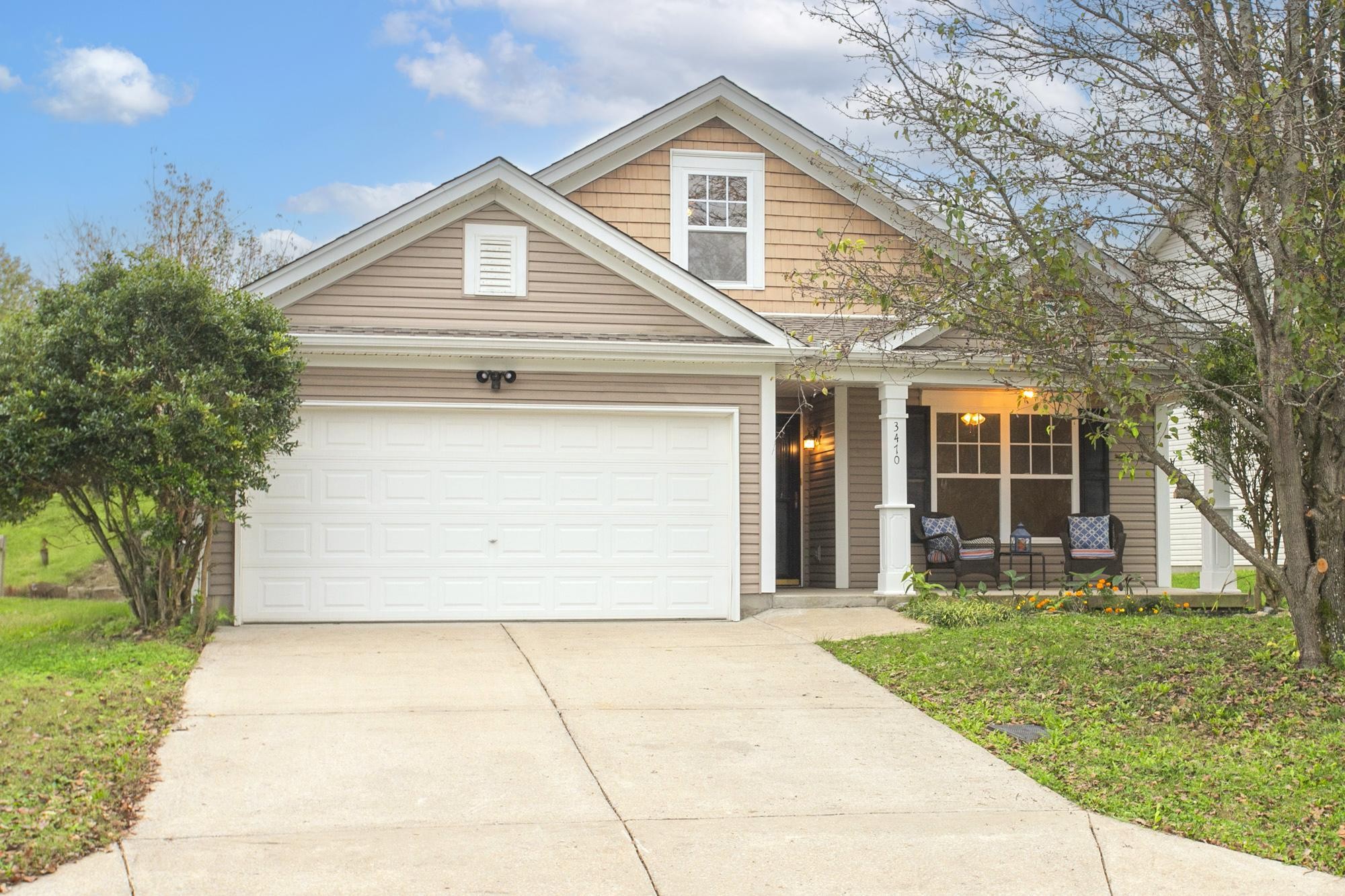 front view of a house with a yard