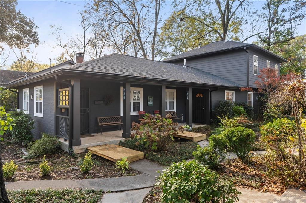 a front view of a house with garden