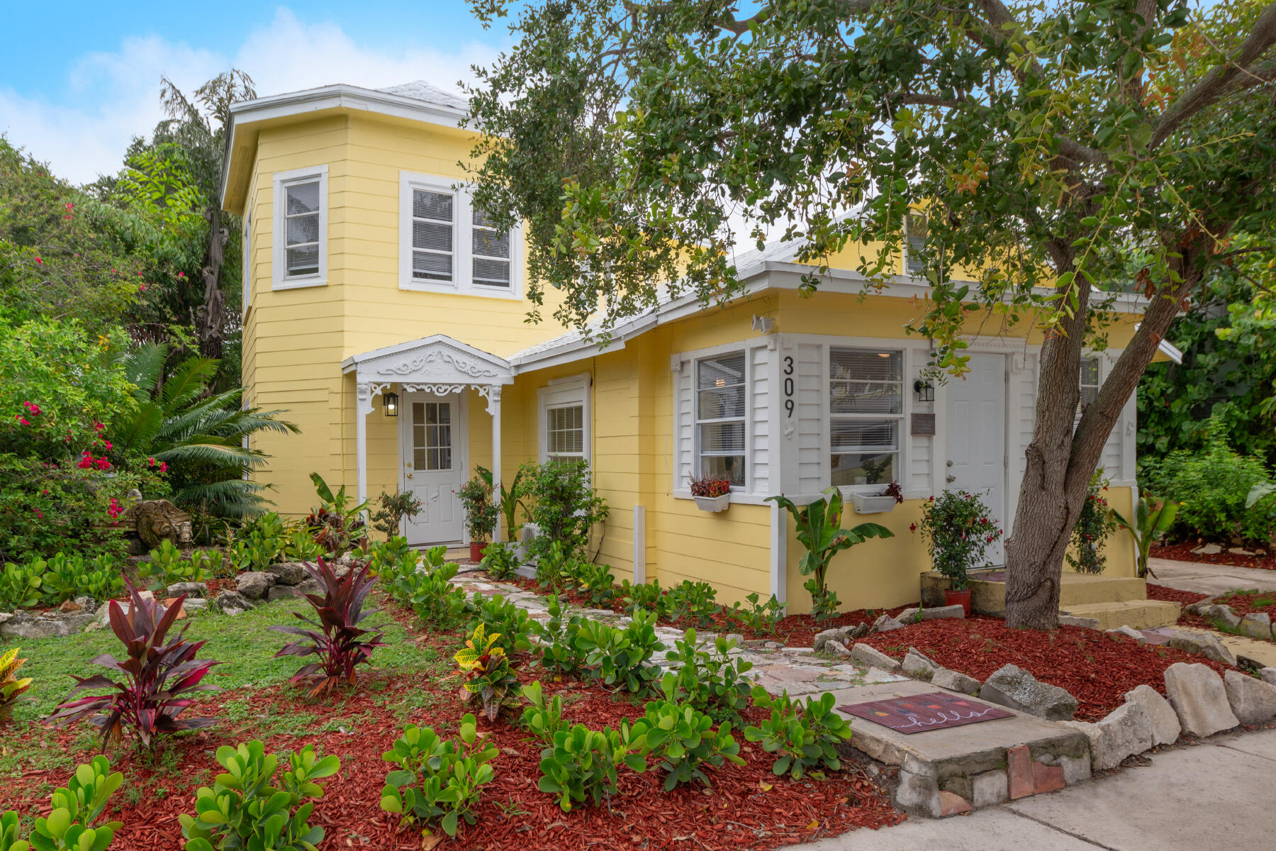 a front view of a house with garden