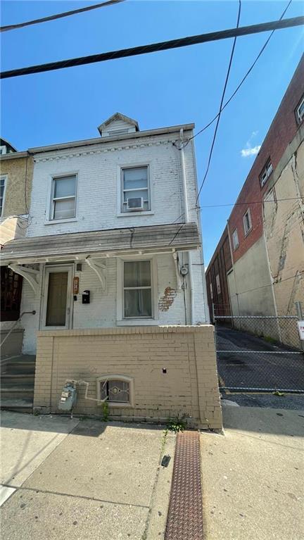 a view of a front of house with a street