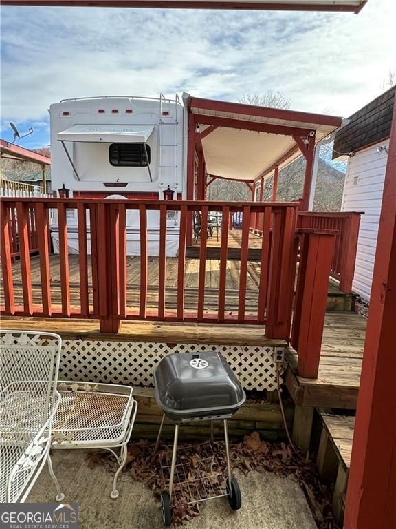 a balcony with a table and chairs