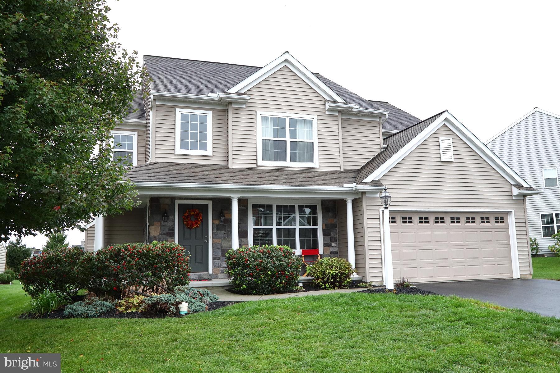 front view of a house and a yard