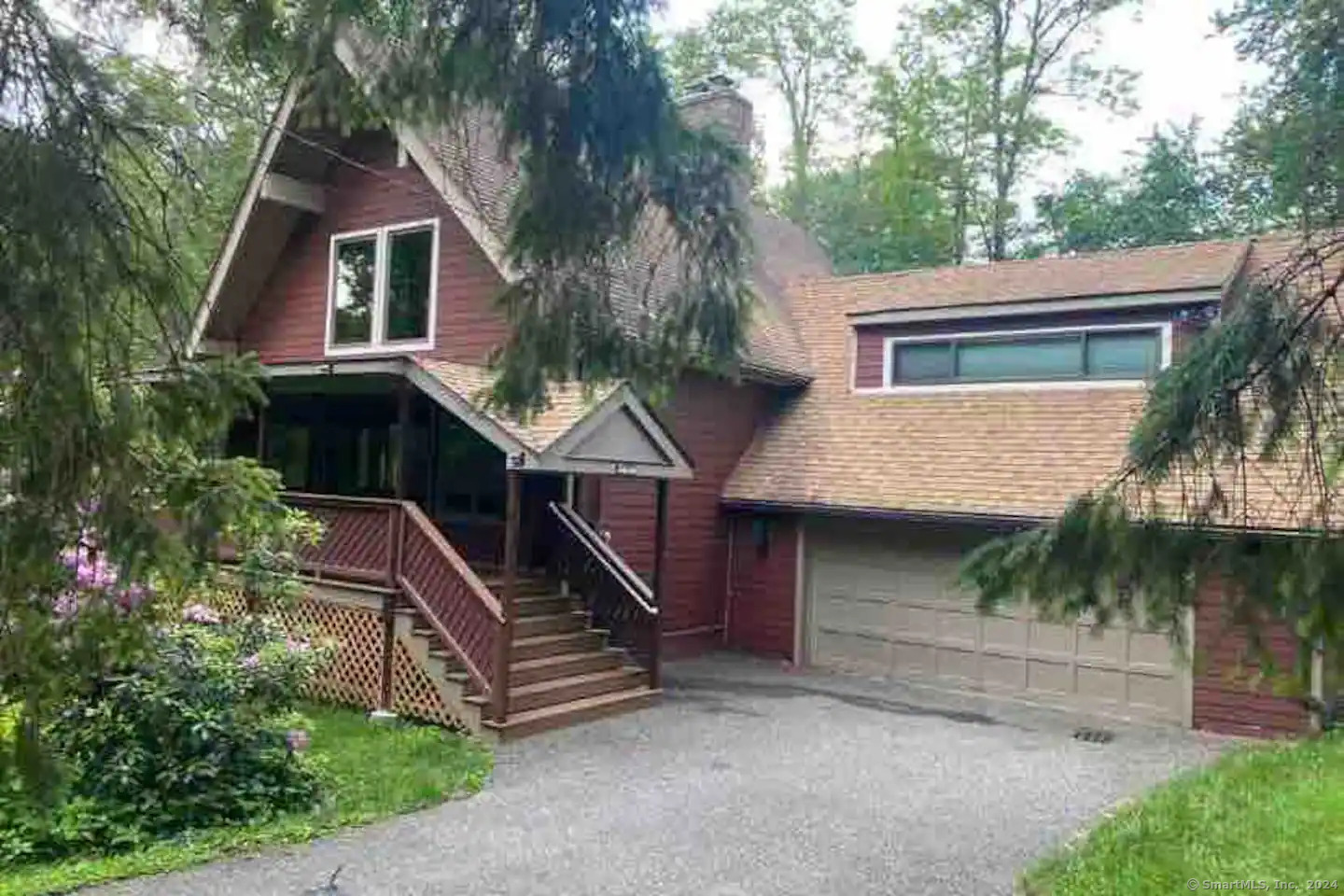 a view of house with outdoor space and trees