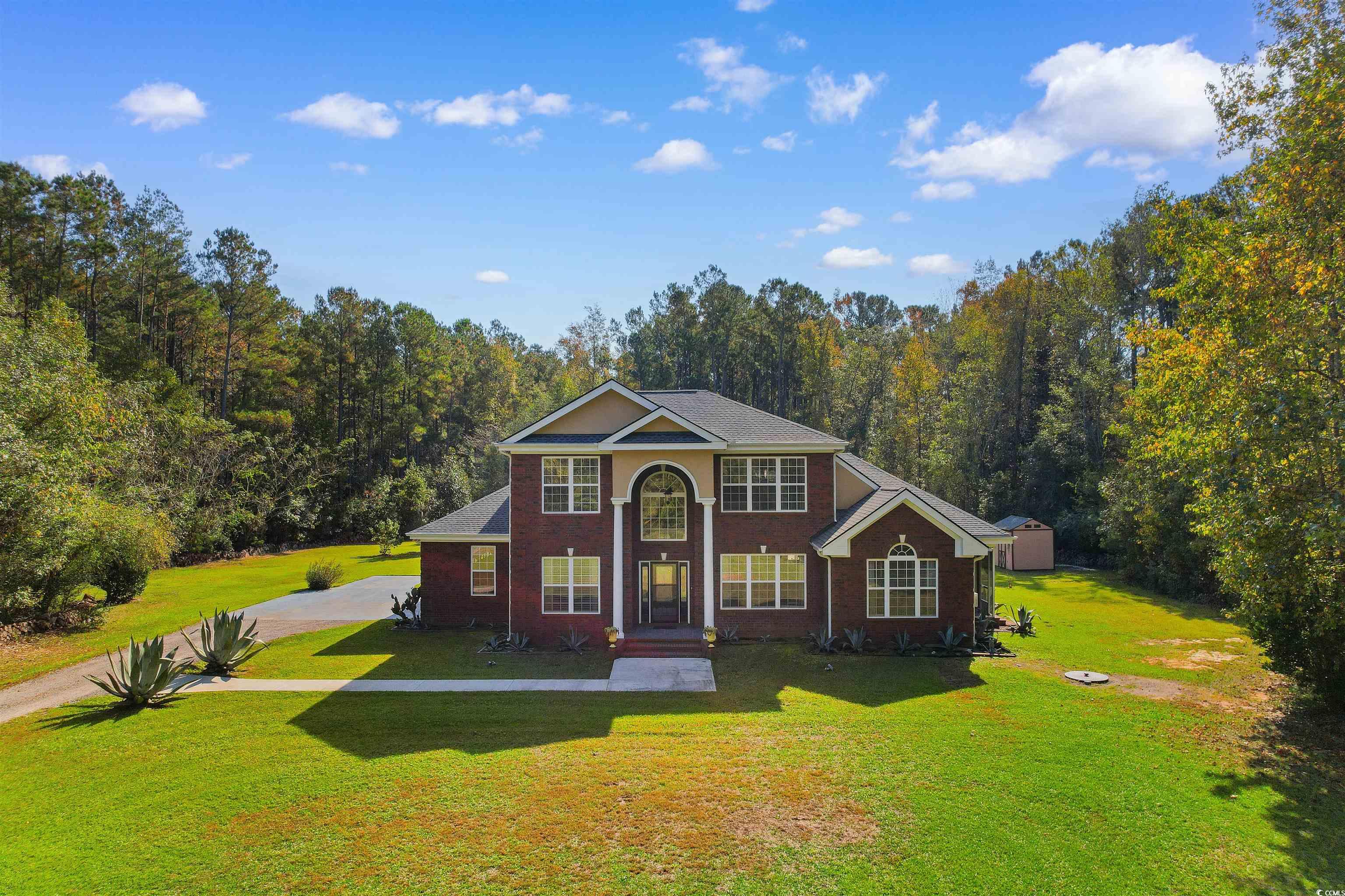 View of front of property featuring a front yard