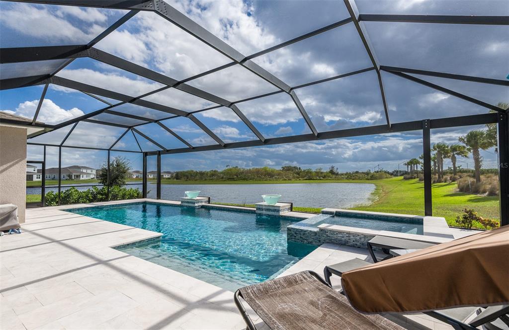 a view of a swimming pool with a patio