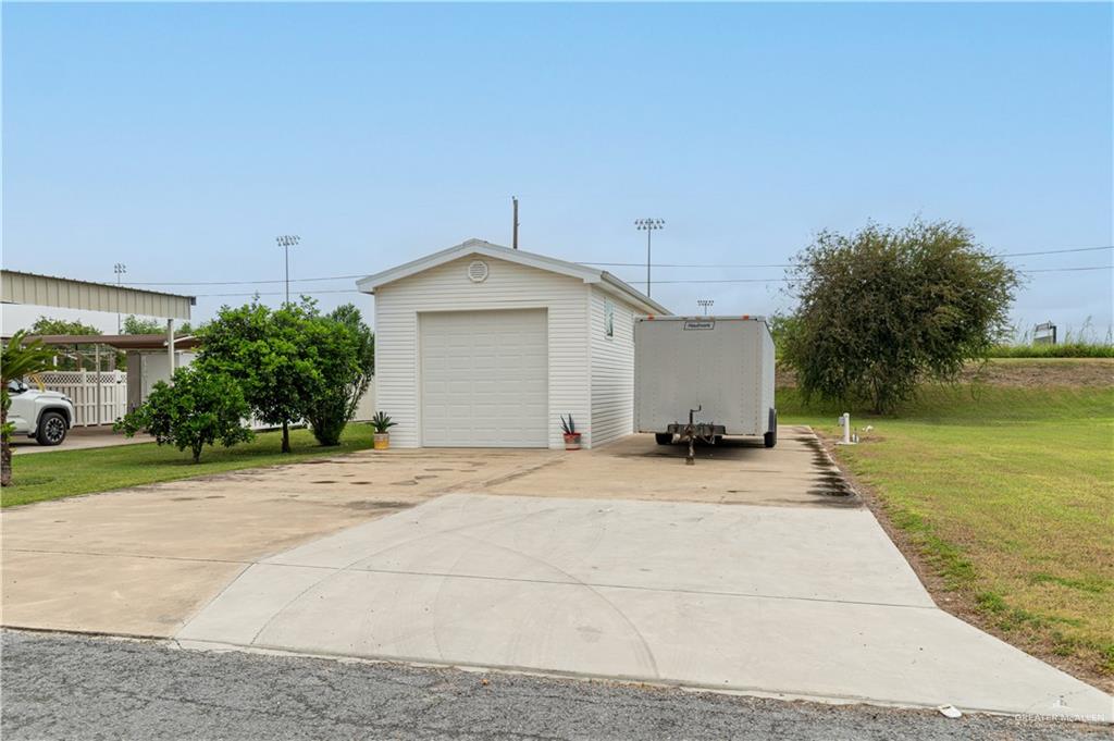 Garage with a lawn