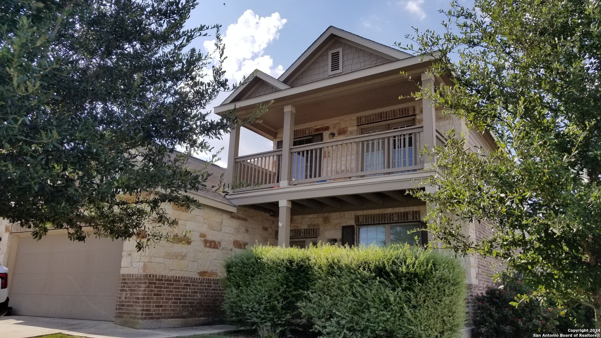 front view of house with a tree