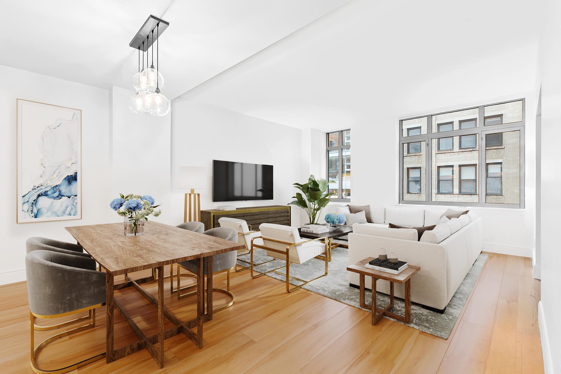 a living room with furniture and wooden floor