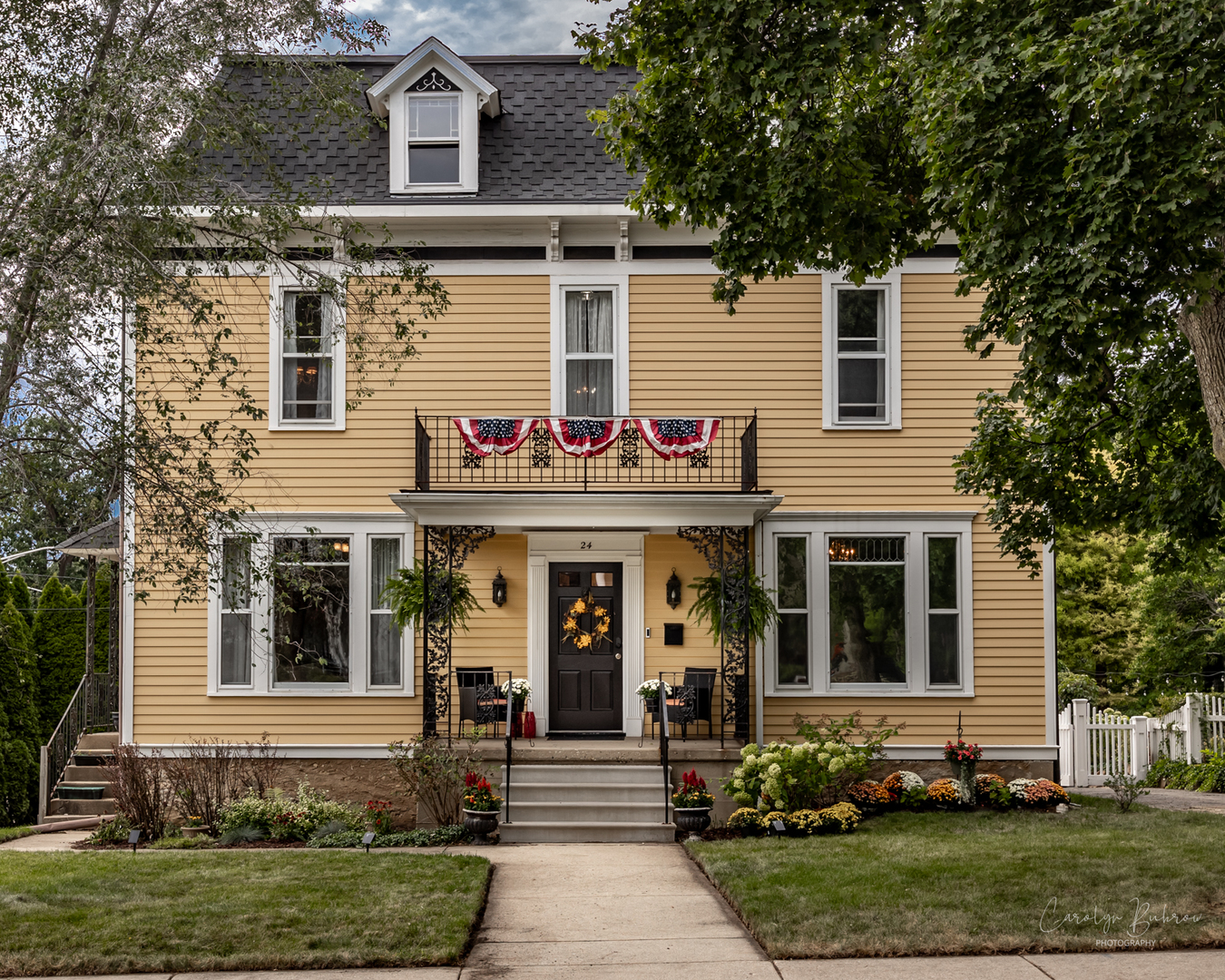 a front view of a house with garden