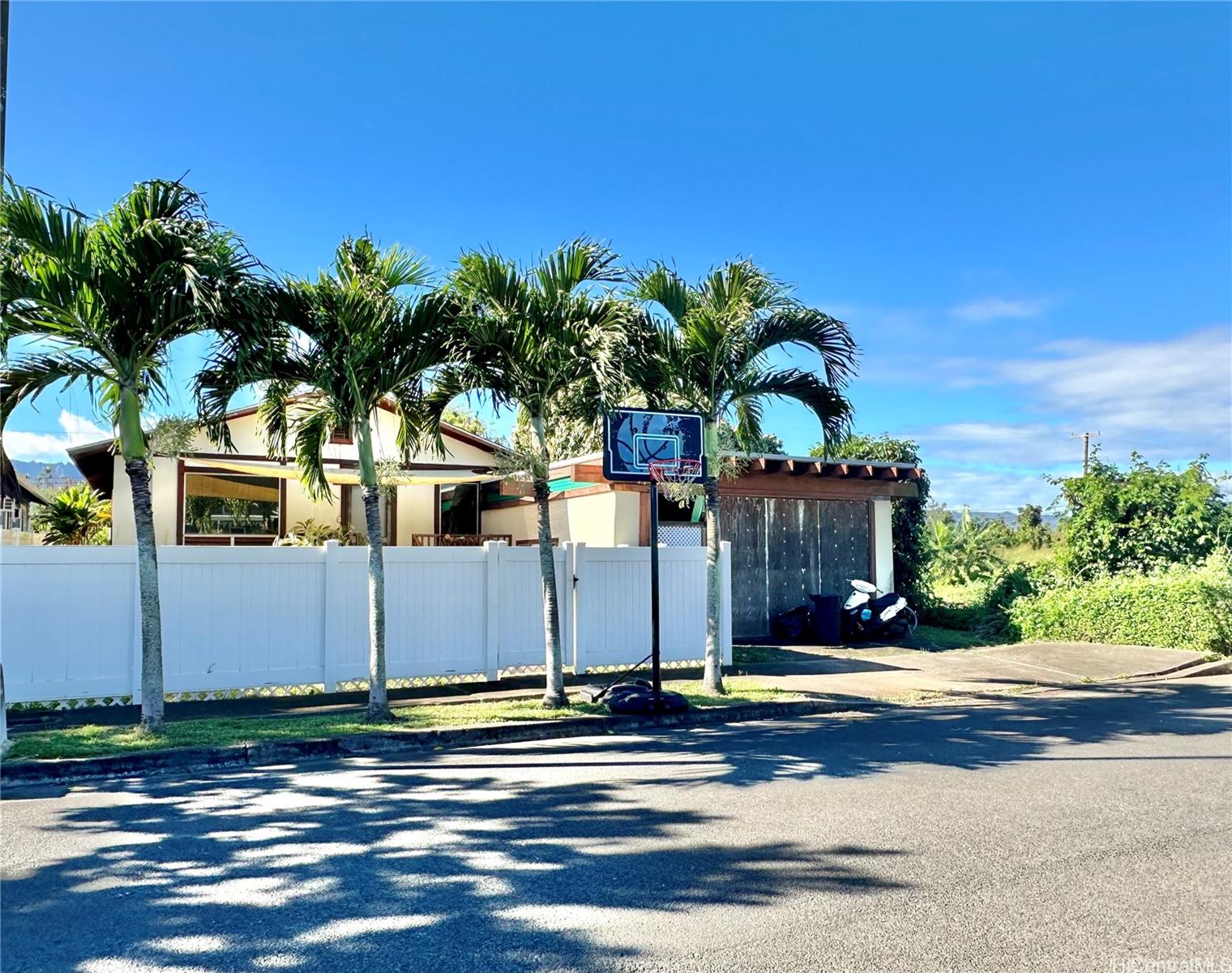 a view of a house with a street