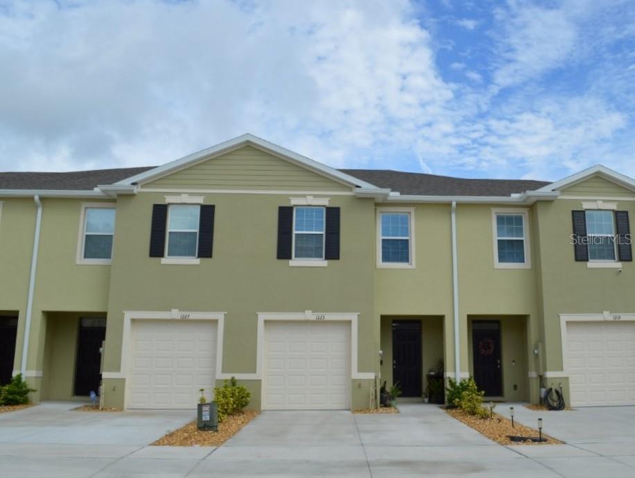 a front view of a house with yard