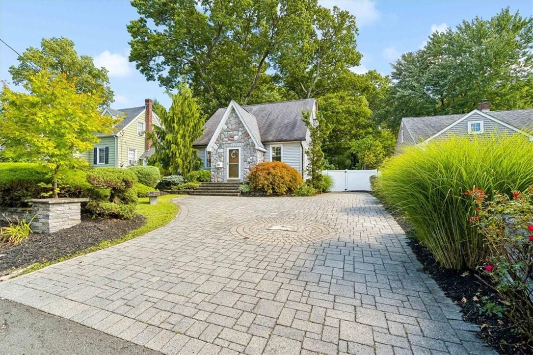 a front view of a house with garden