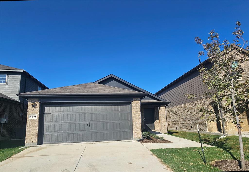 a front view of a house with a garage