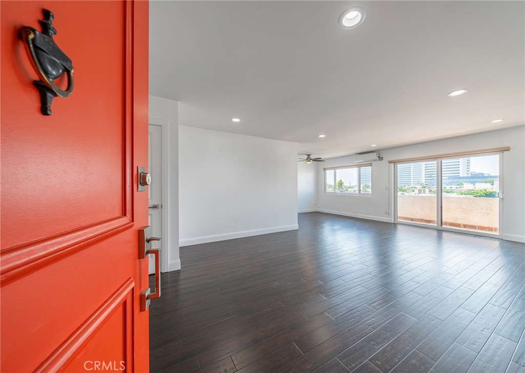 Unit #302 entrance to the living room, dining area, and balcony.