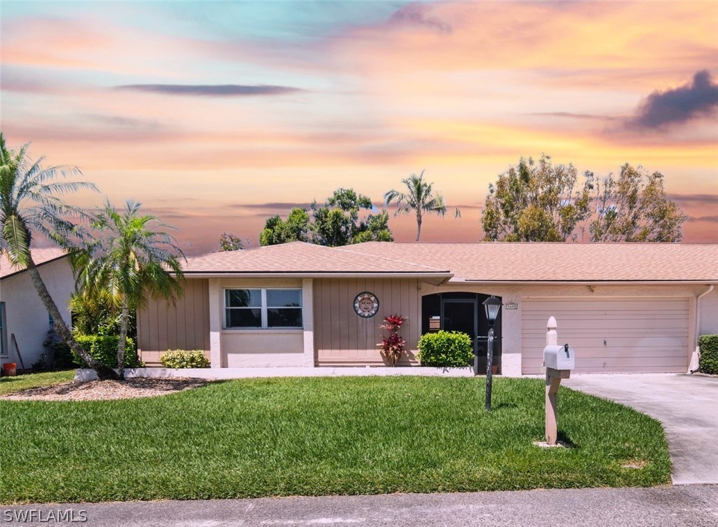 front view of a house with a yard