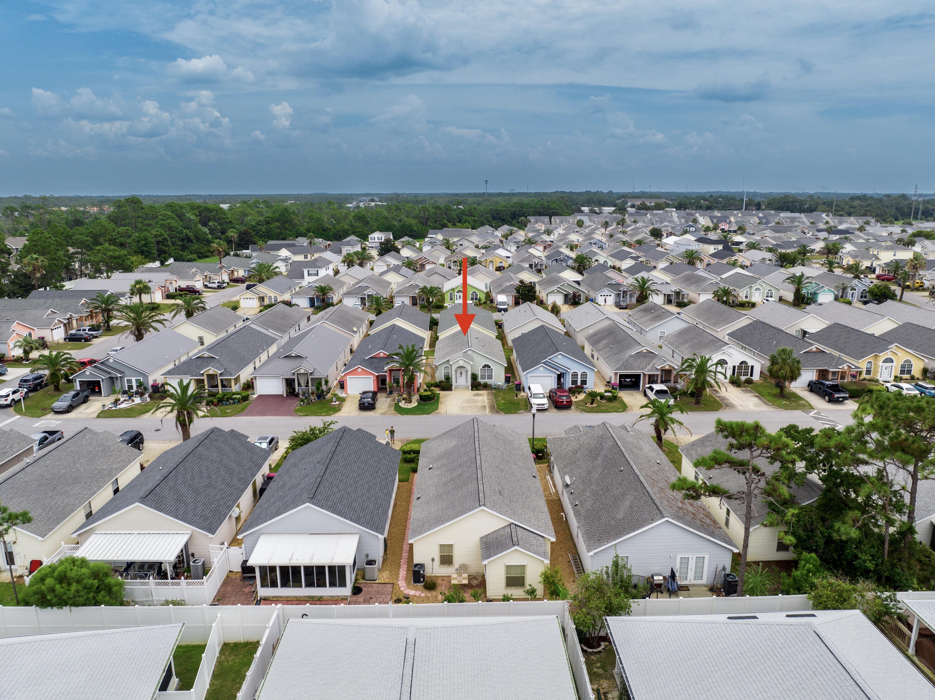 an aerial view of residential houses with outdoor space