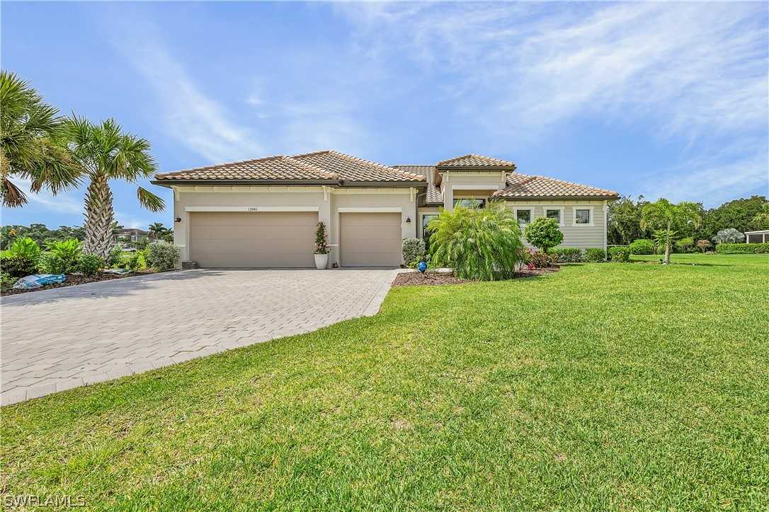 a front view of a house with a yard and garage