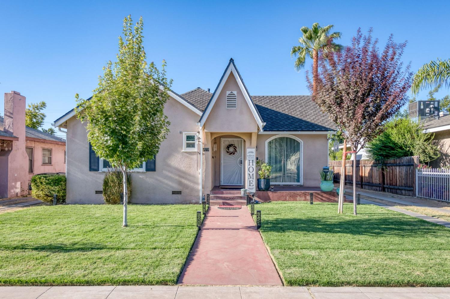 a front view of a house with garden