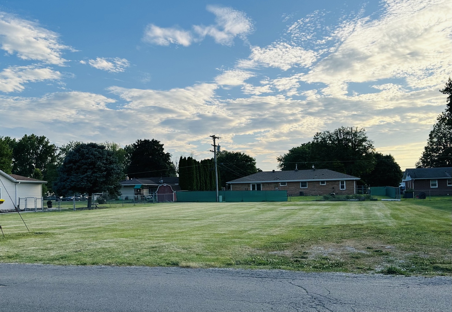 a view of a golf course with a park