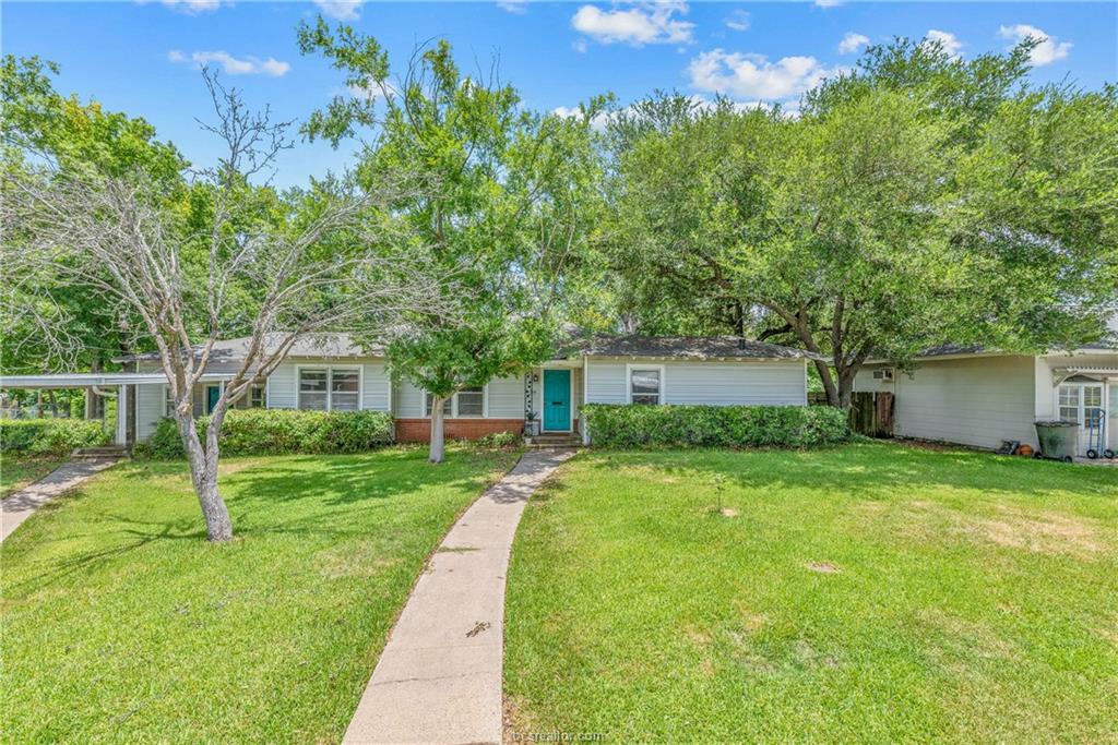 View of front of property with a front lawn