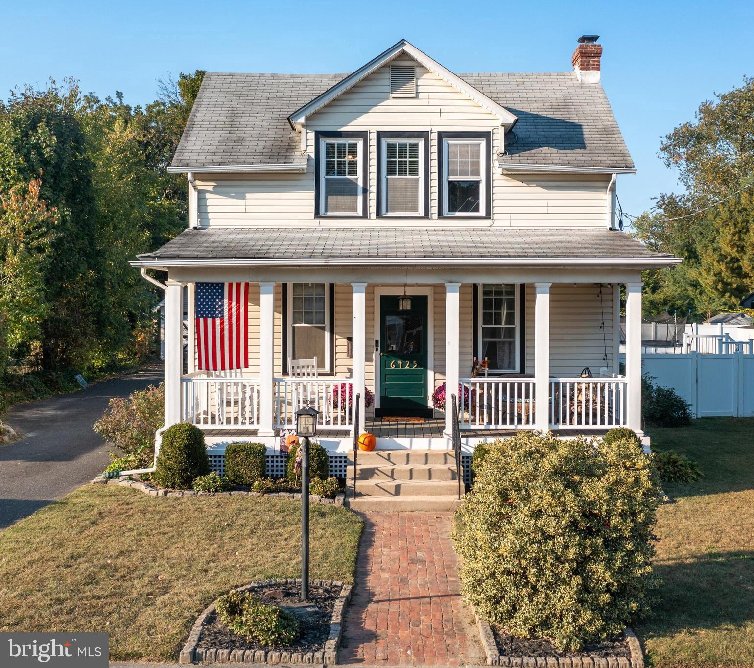 a front view of a house with a porch