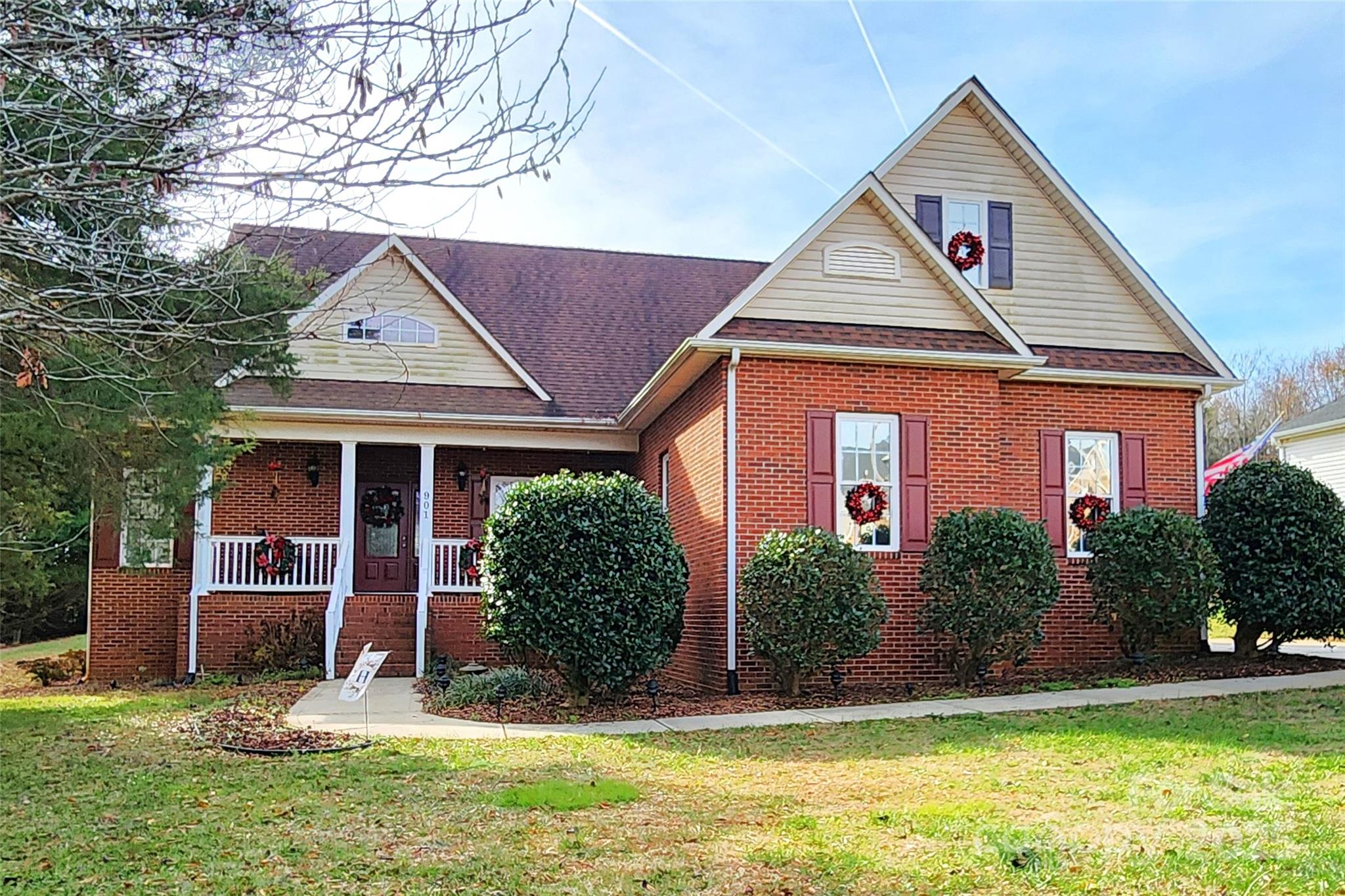 a front view of a house with a yard