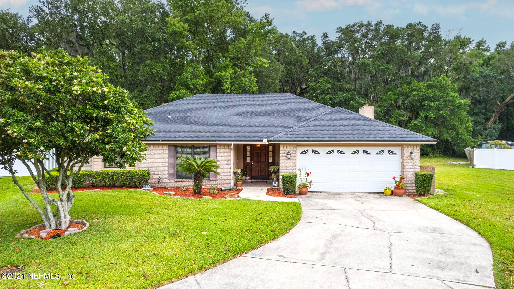 a view of house with a yard