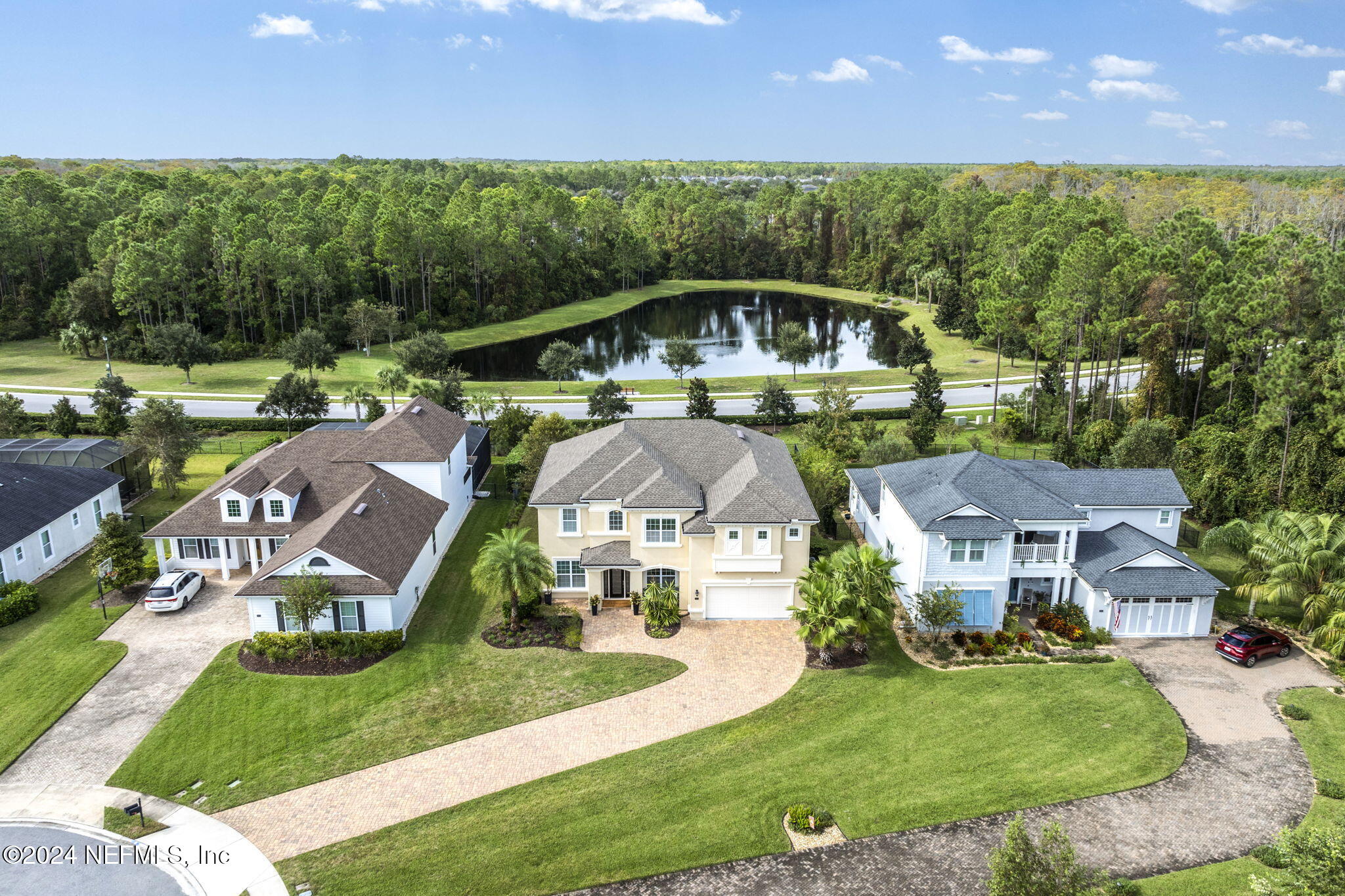 an aerial view of a house with garden space and street view