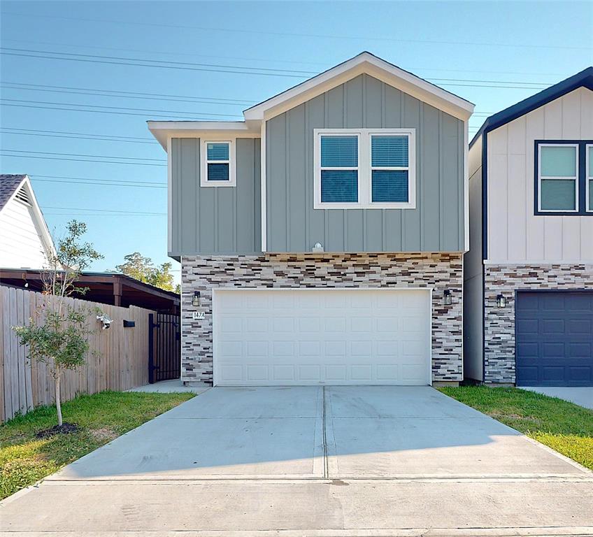 a front view of a house with garage