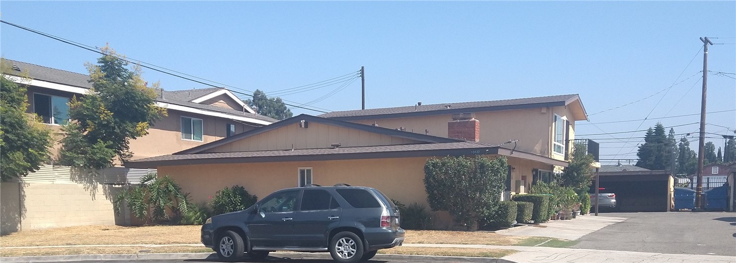 a front view of a house with parking