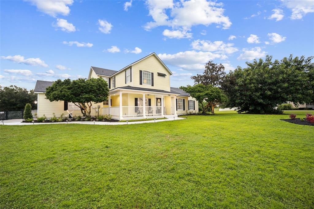 a front view of a house with garden