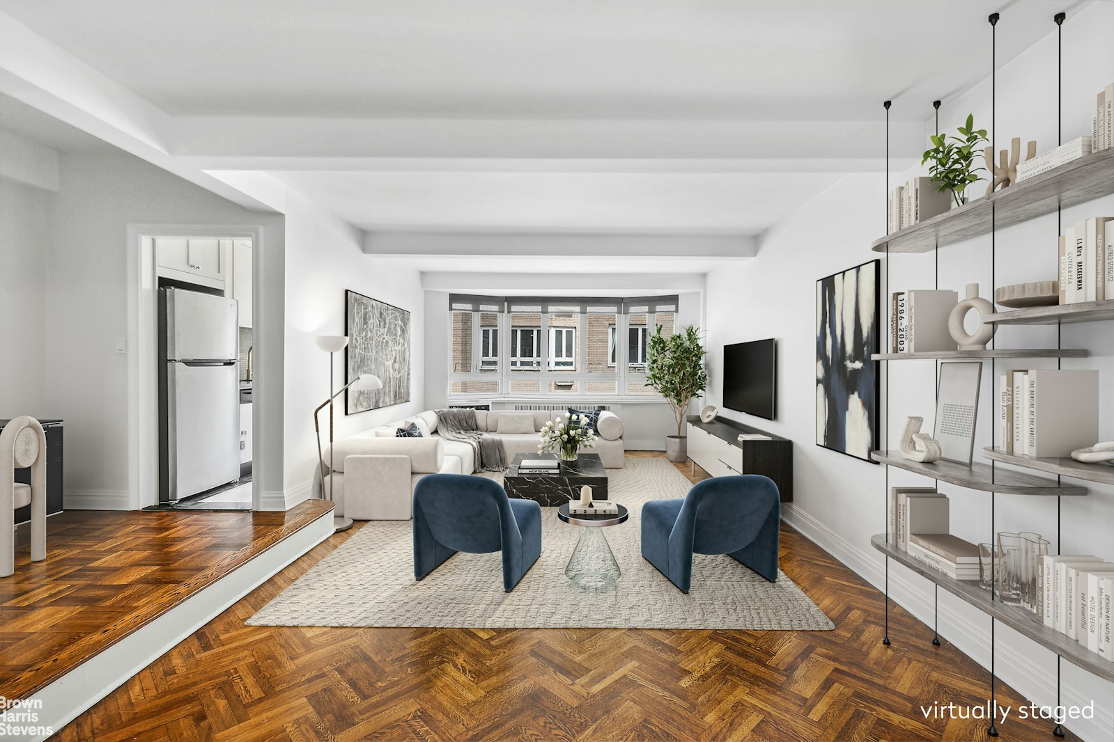 a living room with fireplace furniture and a rug