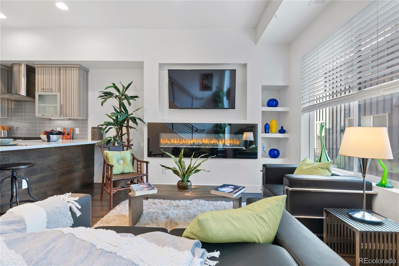 a living room with furniture and a lamp