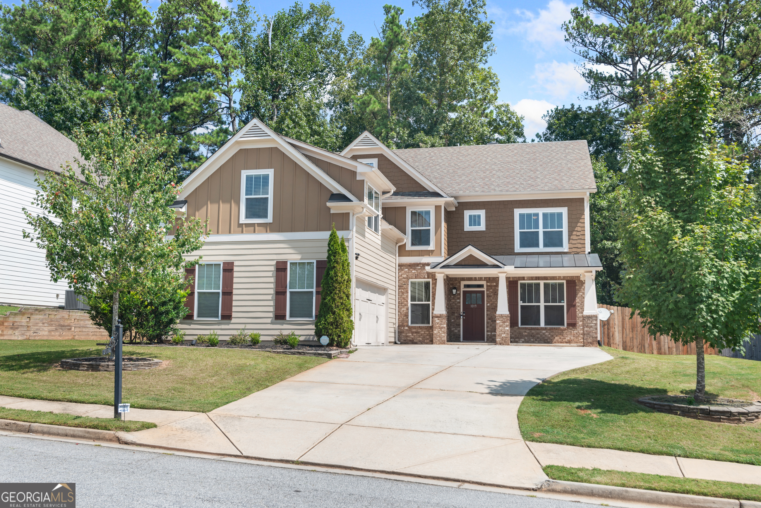 front view of a house with a yard