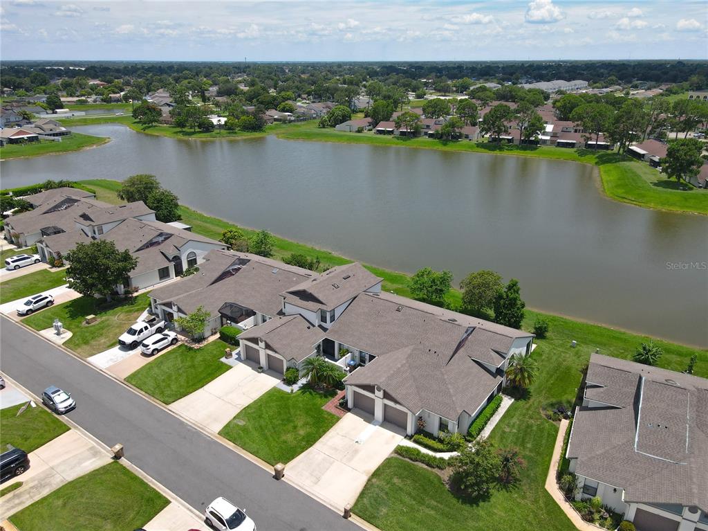 an aerial view of a house with a lake view