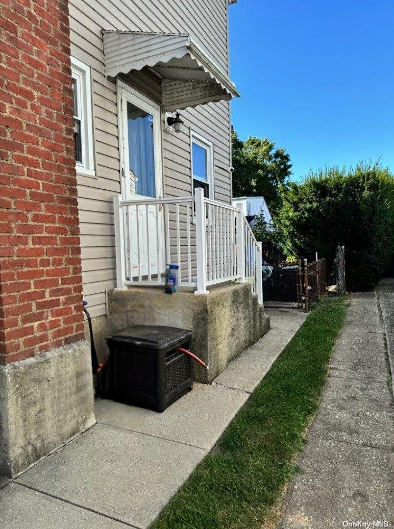 a view of house with backyard and seating area