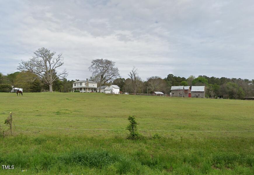 a view of a field with an trees