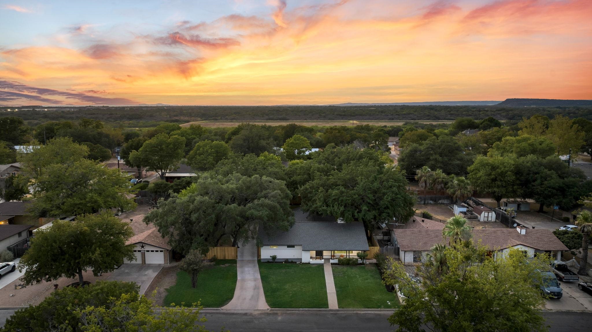 an aerial view of a house with mountain view