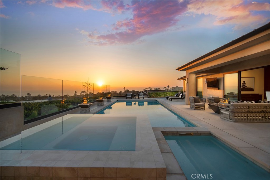 a view of a swimming pool with a lounge chair