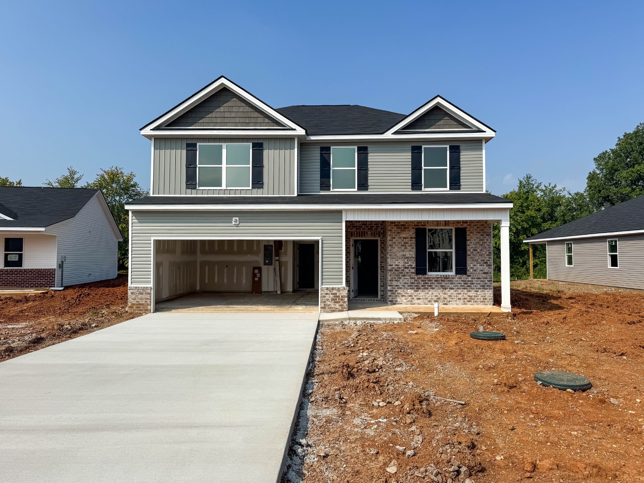 a front view of a house with a yard