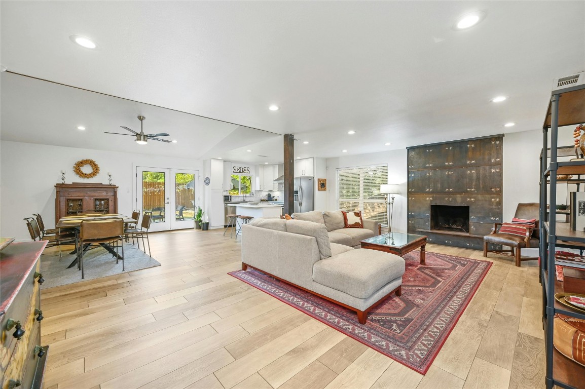 a living room with furniture fireplace and a table